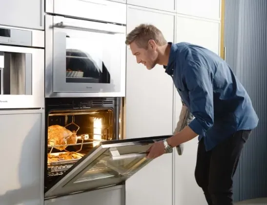 man opening thermador oven